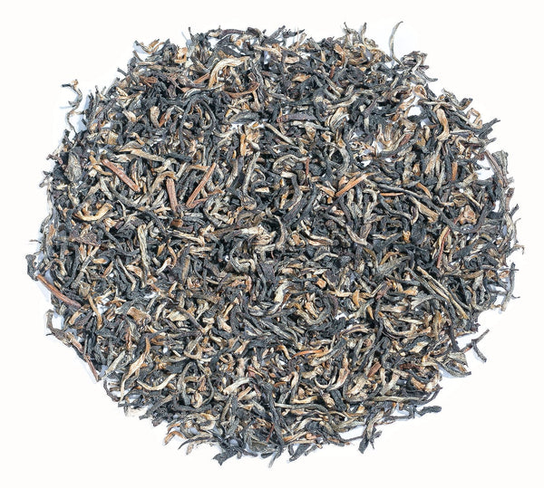 Aureate and Charcoal leaves of Assam Golden Tips tea direct from Chota Tingrai Tea Estate