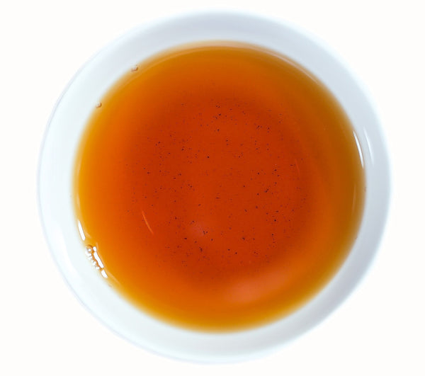 Deep amber liquor of Assam Golden Tips tea direct from Chota Tingrai Tea Estate